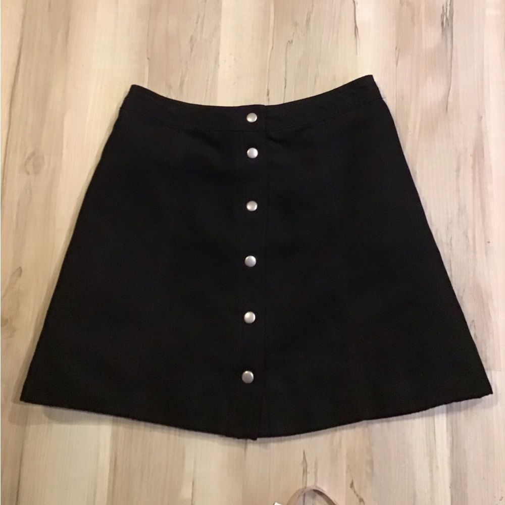 Divided black mini skirt size 6.